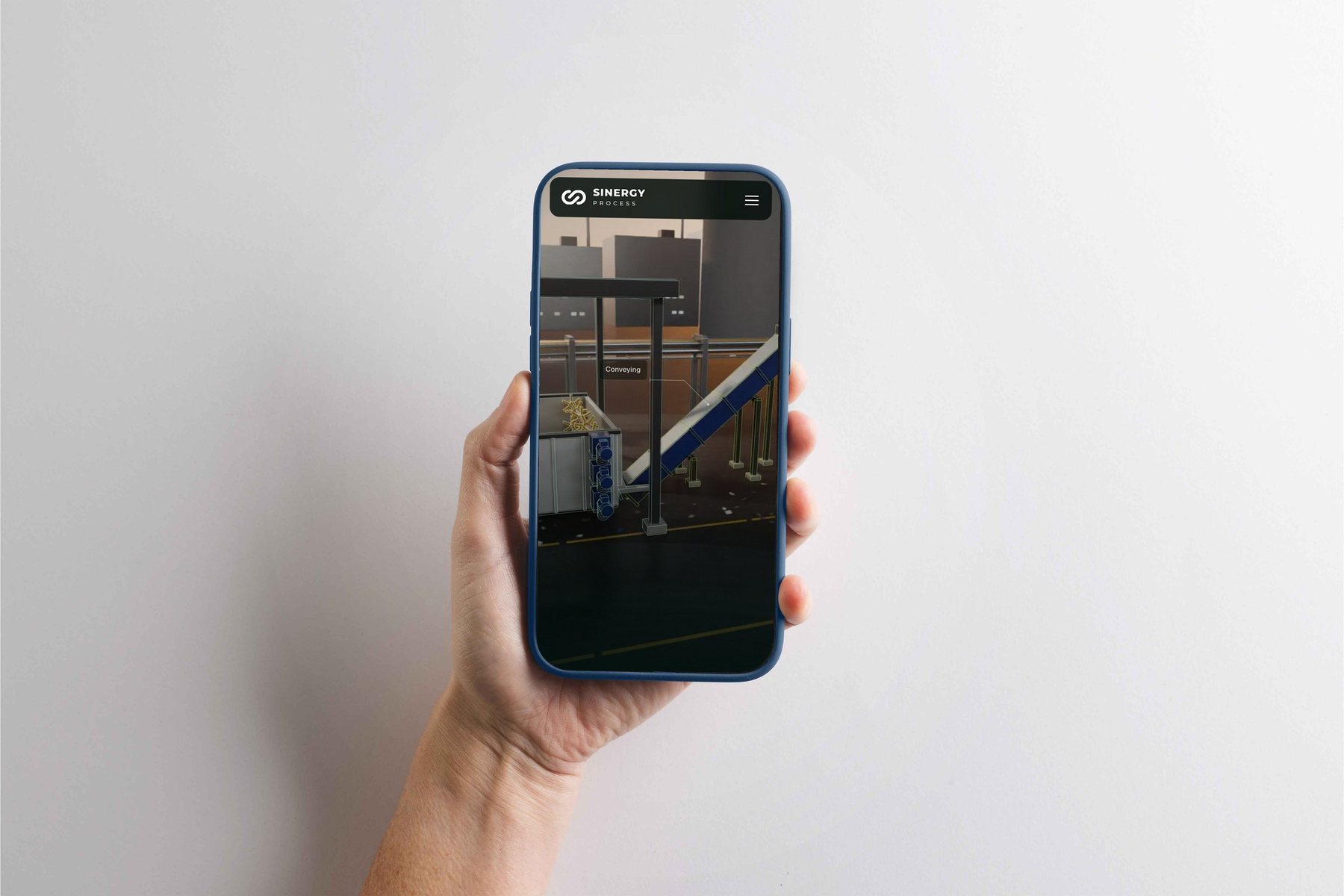 Sinergy Process website on a phone, with the CAD drawn over the machinery